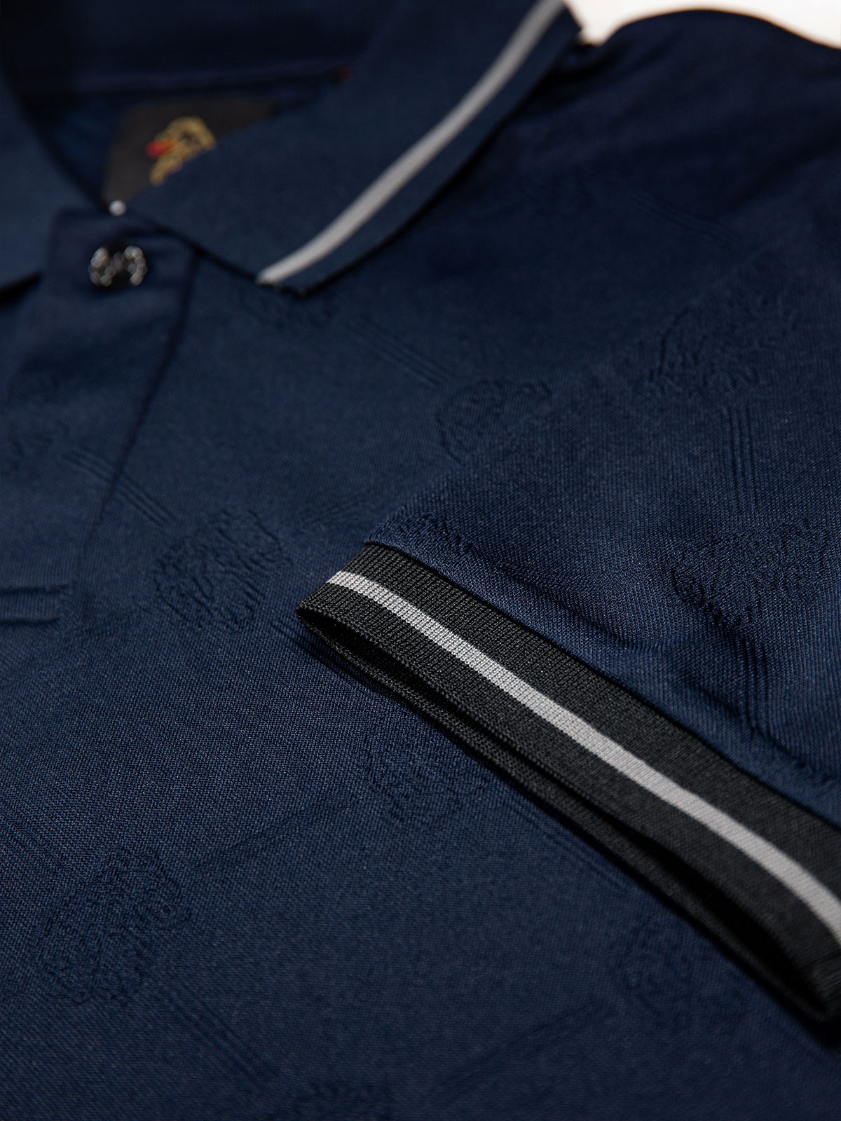 Men's navy polo shirt with polo collar.