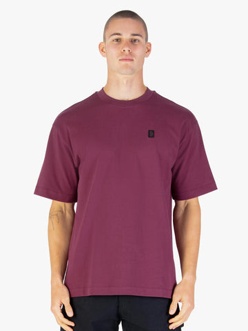 Men's relaxed-fit red t-shirt with crew neck and short sleeves worn by a model - front view.