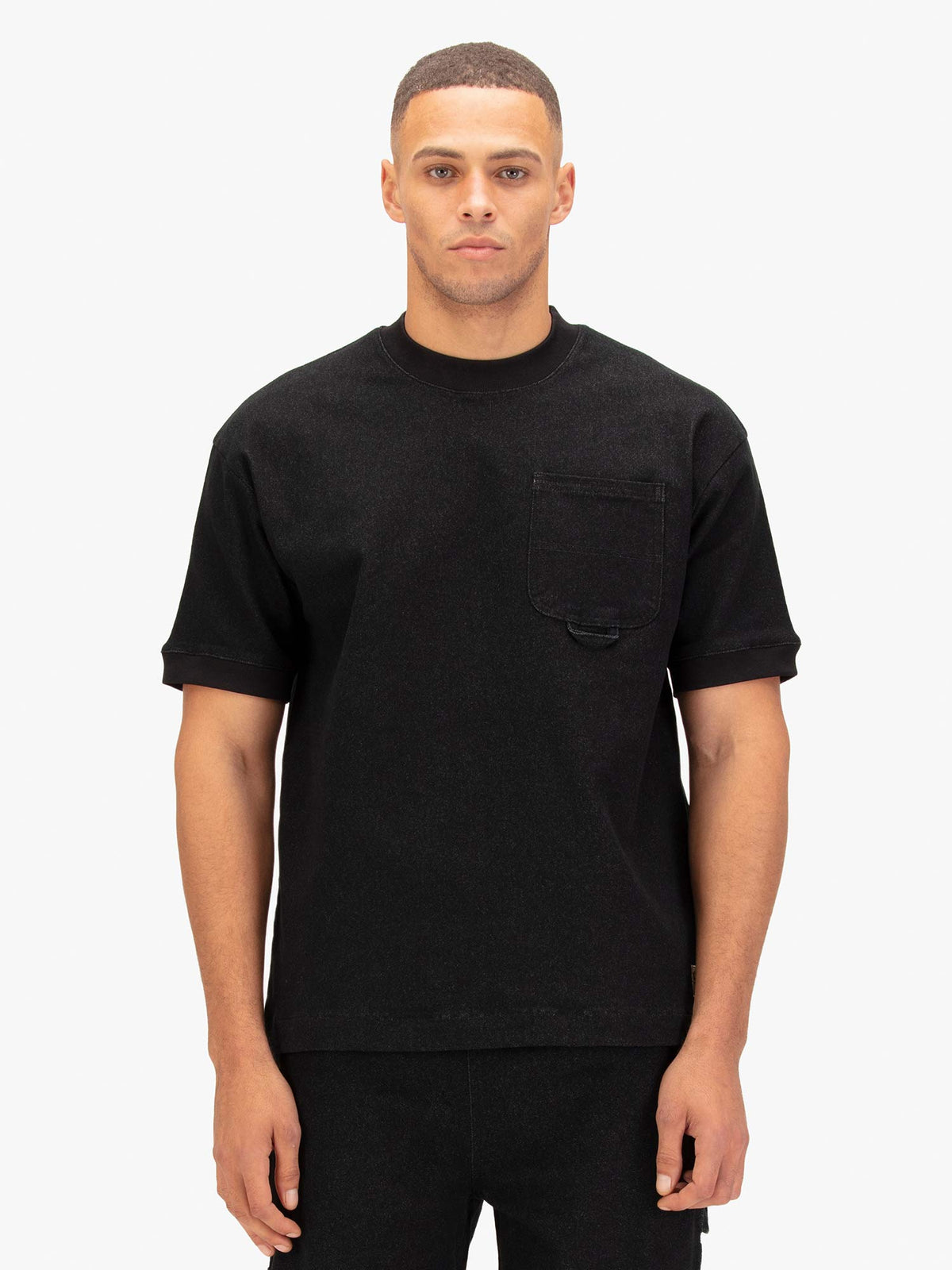 Men's black t-shirt with crew neck and short sleeves worn by a model - front view.