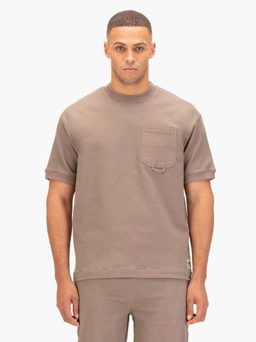 Men's brown t-shirt with crew neck and short sleeves worn by a model - front view.