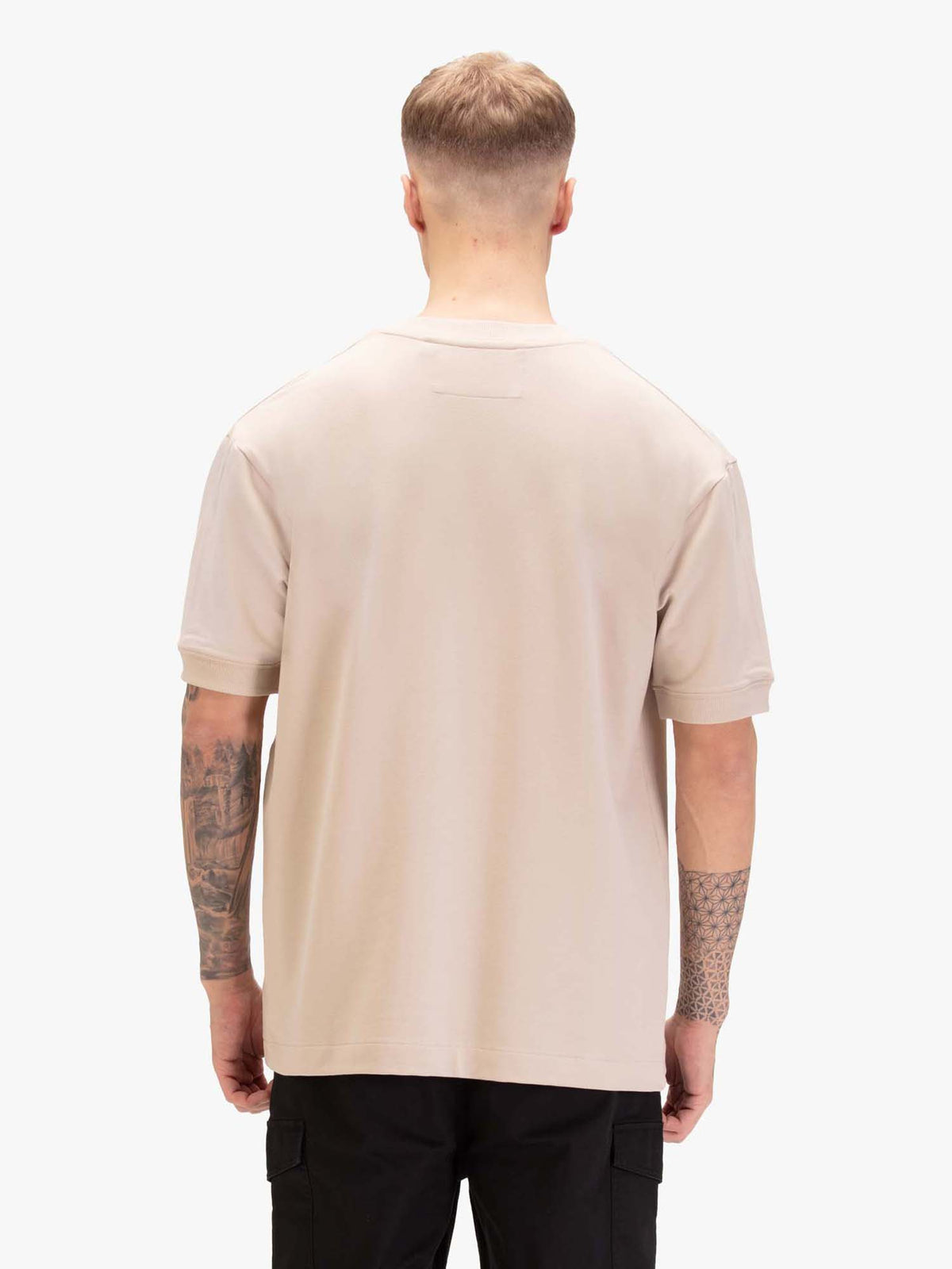 Men's relaxed-fit beige t-shirt with crew neck and short sleeves, worn by a model, back view