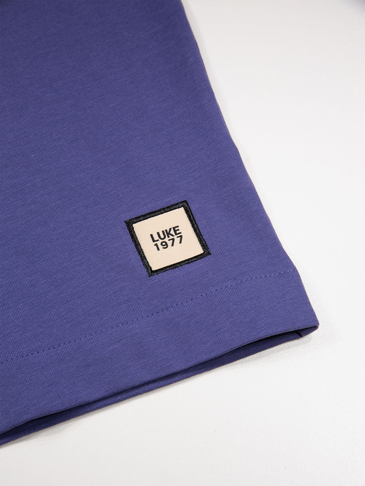 Men's purple t-shirt with crew neck and short sleeves.