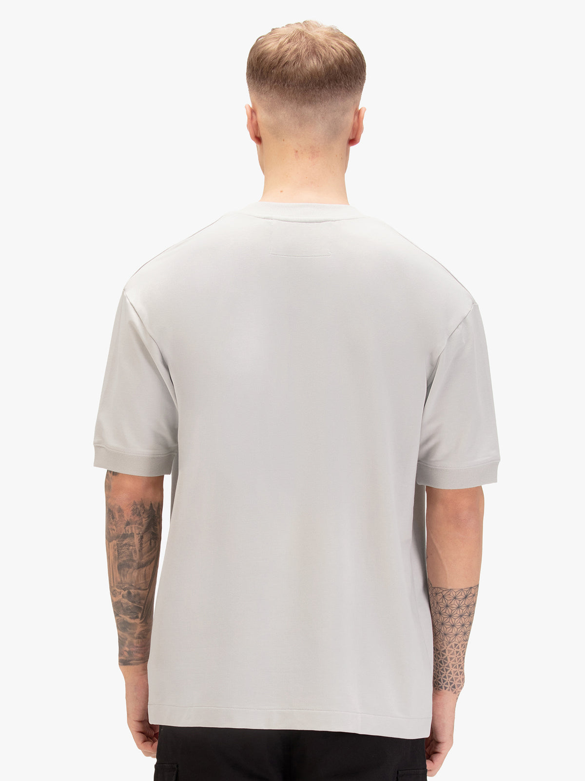 Men's relaxed-fit grey t-shirt with crew neck and short sleeves, worn by a model, back view