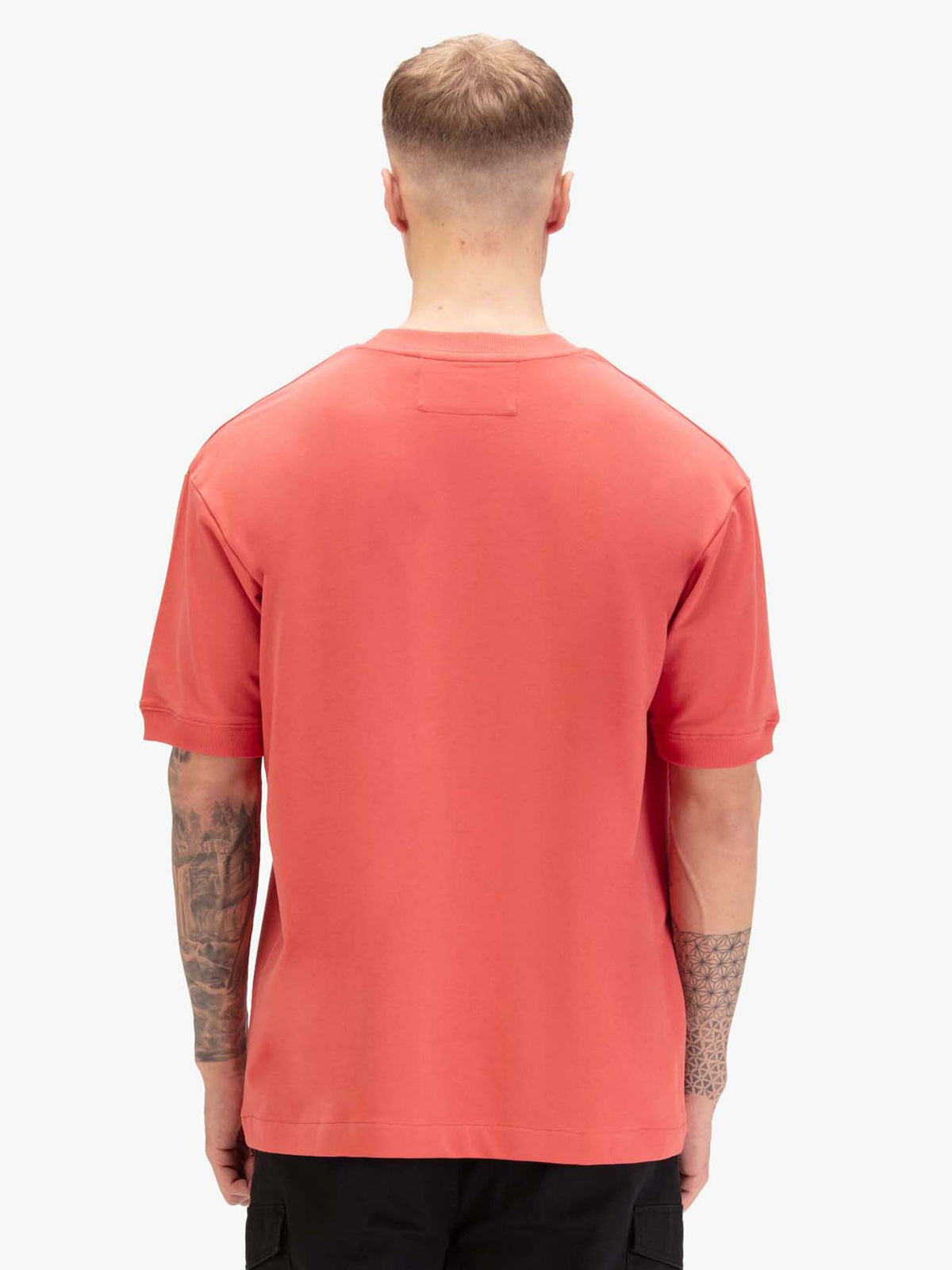 Men's relaxed-fit red t-shirt with crew neck and short sleeves, worn by a model, back view