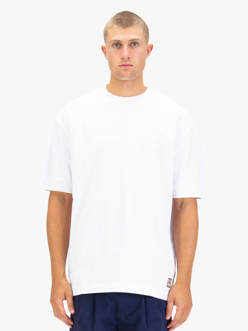 Men's white t-shirt with crew neck and short sleeves worn by a model - front view.
