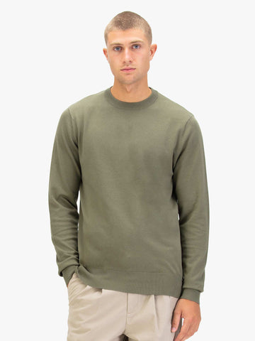 Men's green jumper.