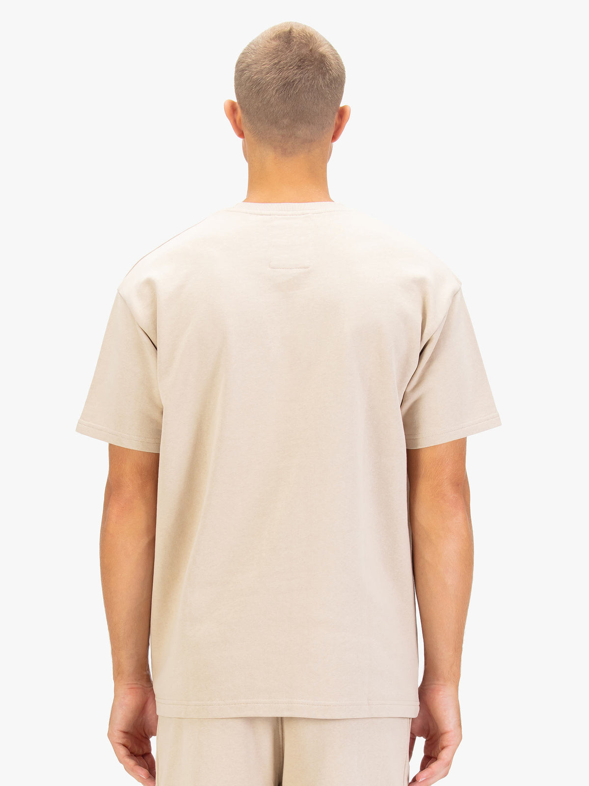 Men's beige t-shirt with crew neck and short sleeves.