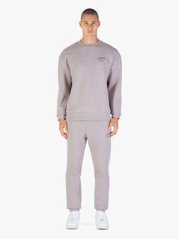 Men's grey tracksuit with crew neck sweatshirt and matching joggers.