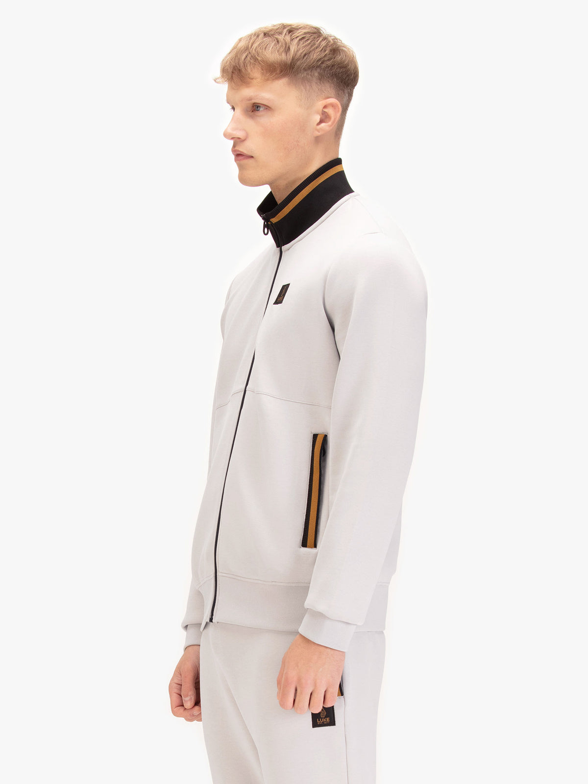 Men's grey sweatshirt with mock neck, worn by a model, side view