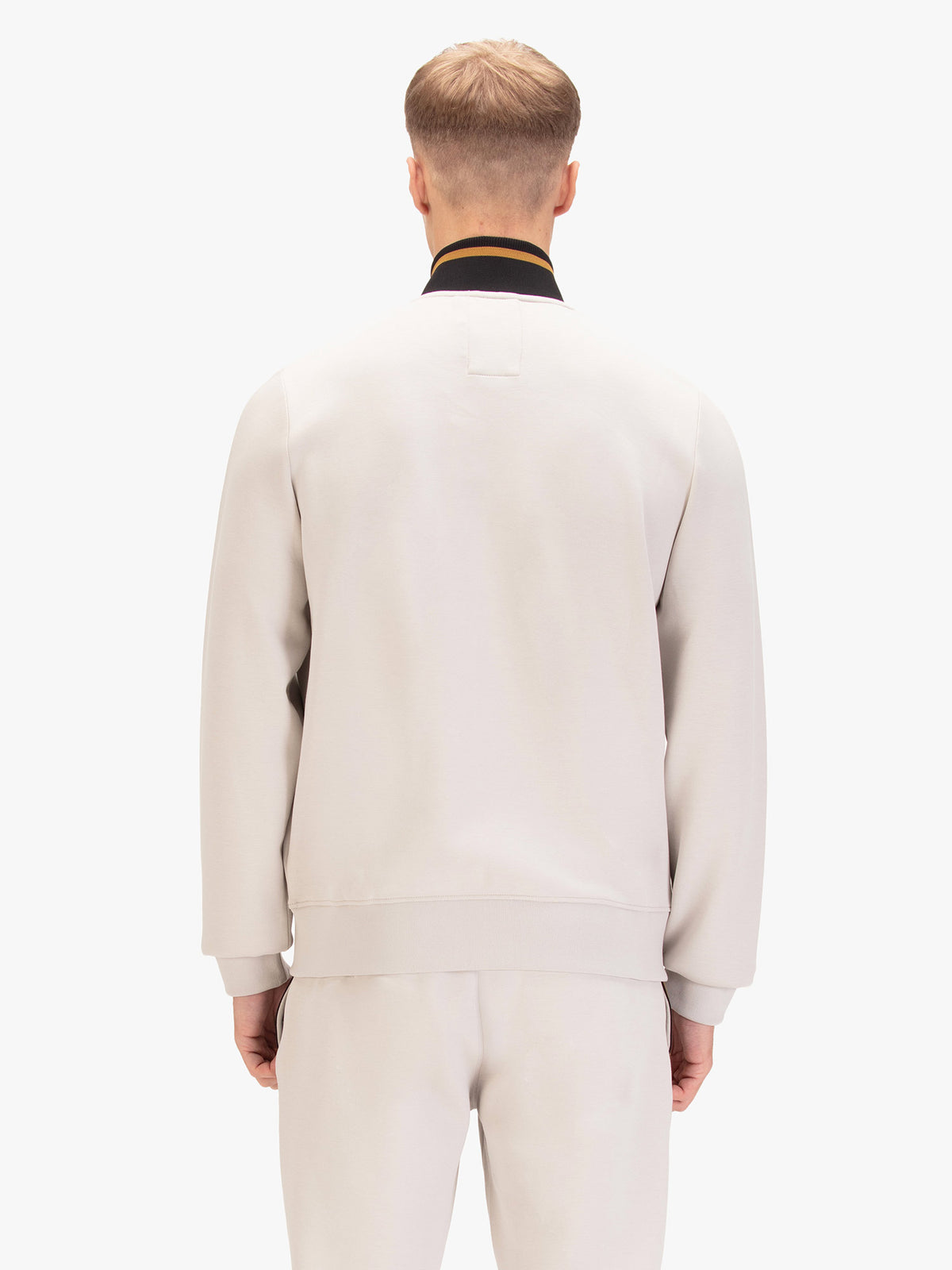 Back view of ice grey LUKE 1977 Makati zip through tracksuit worn by model