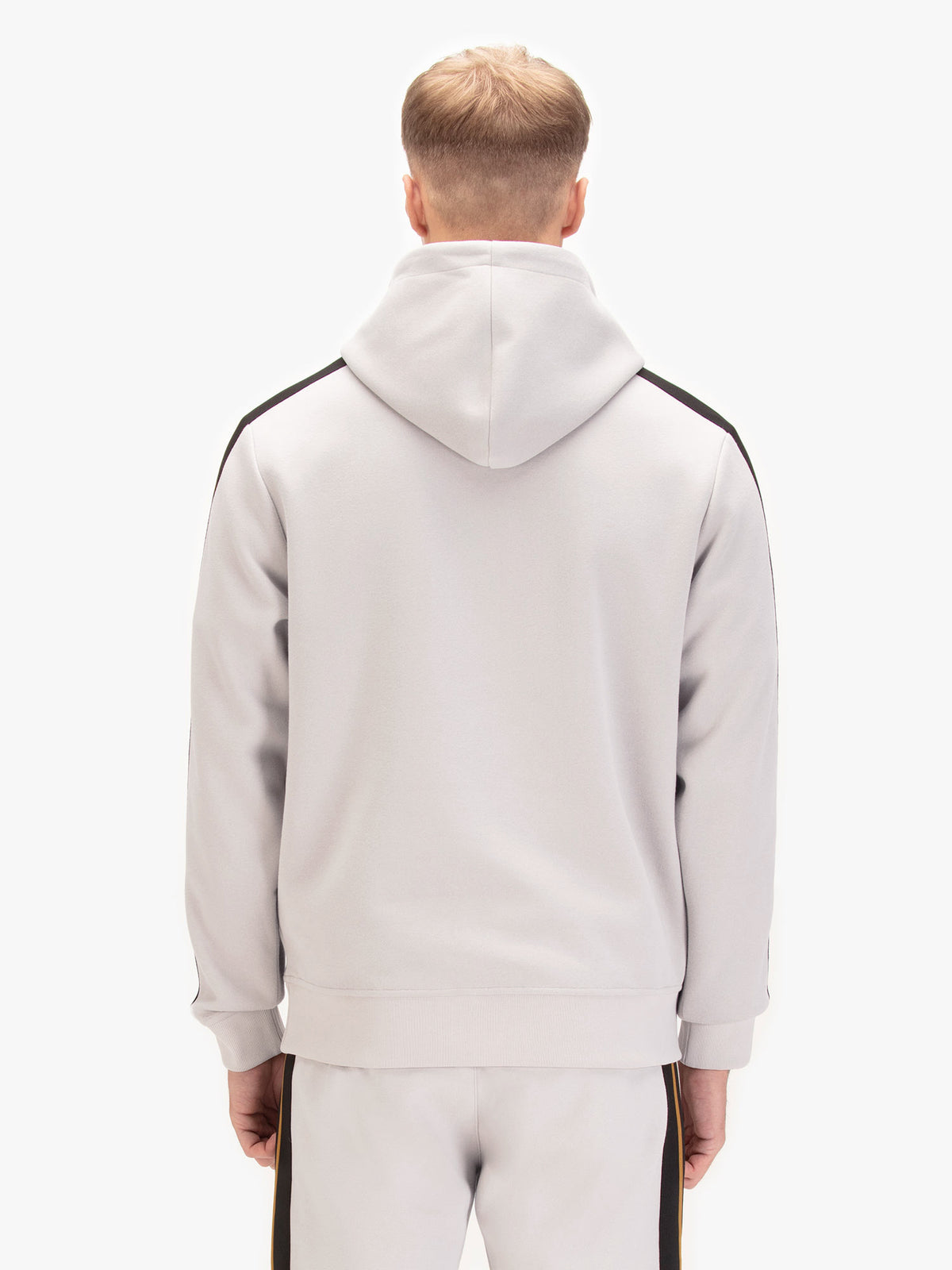 Men's grey hoodie with front pocket and drawstring hood, worn by a model, back view