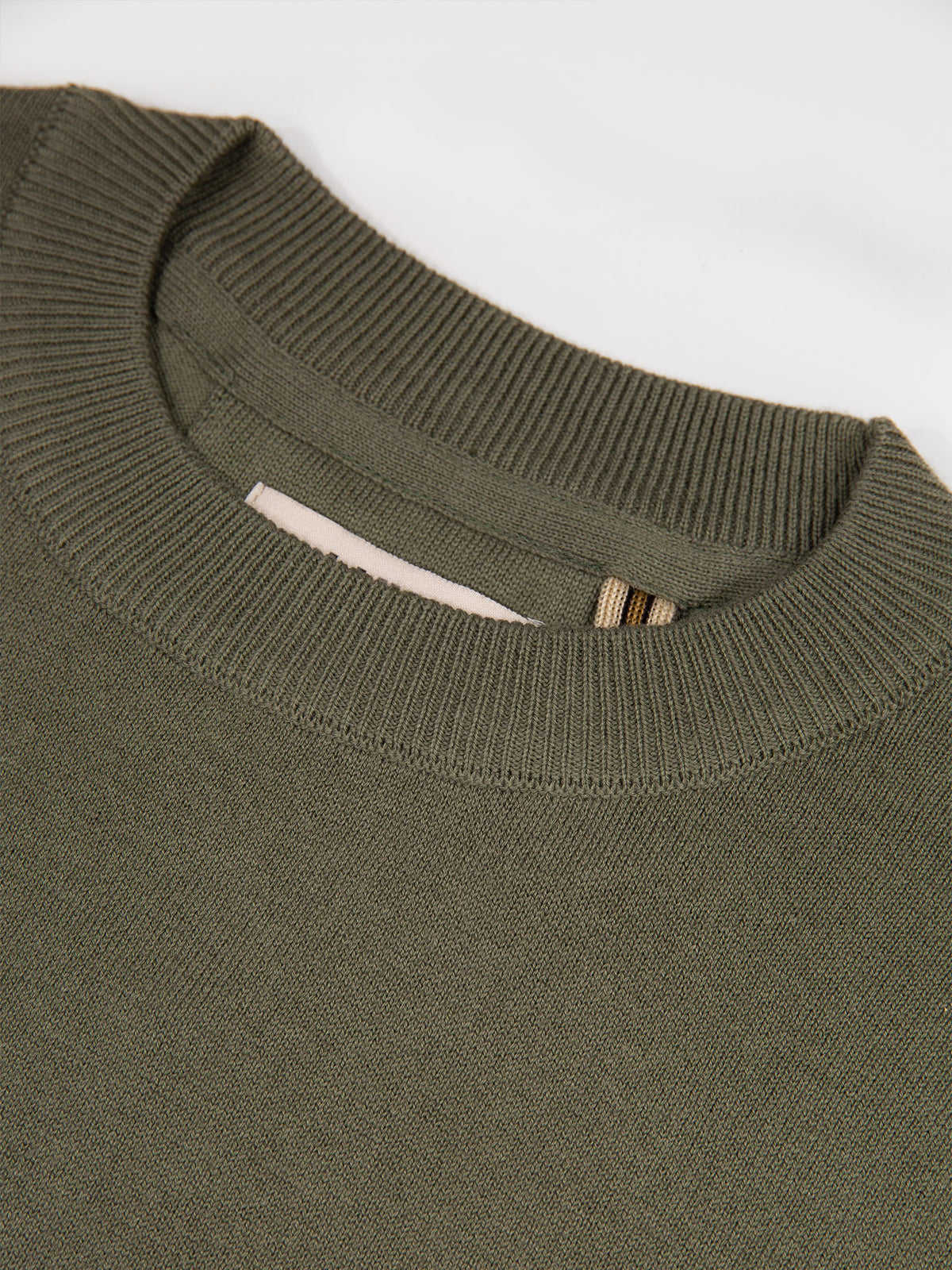 Men's green jumper.