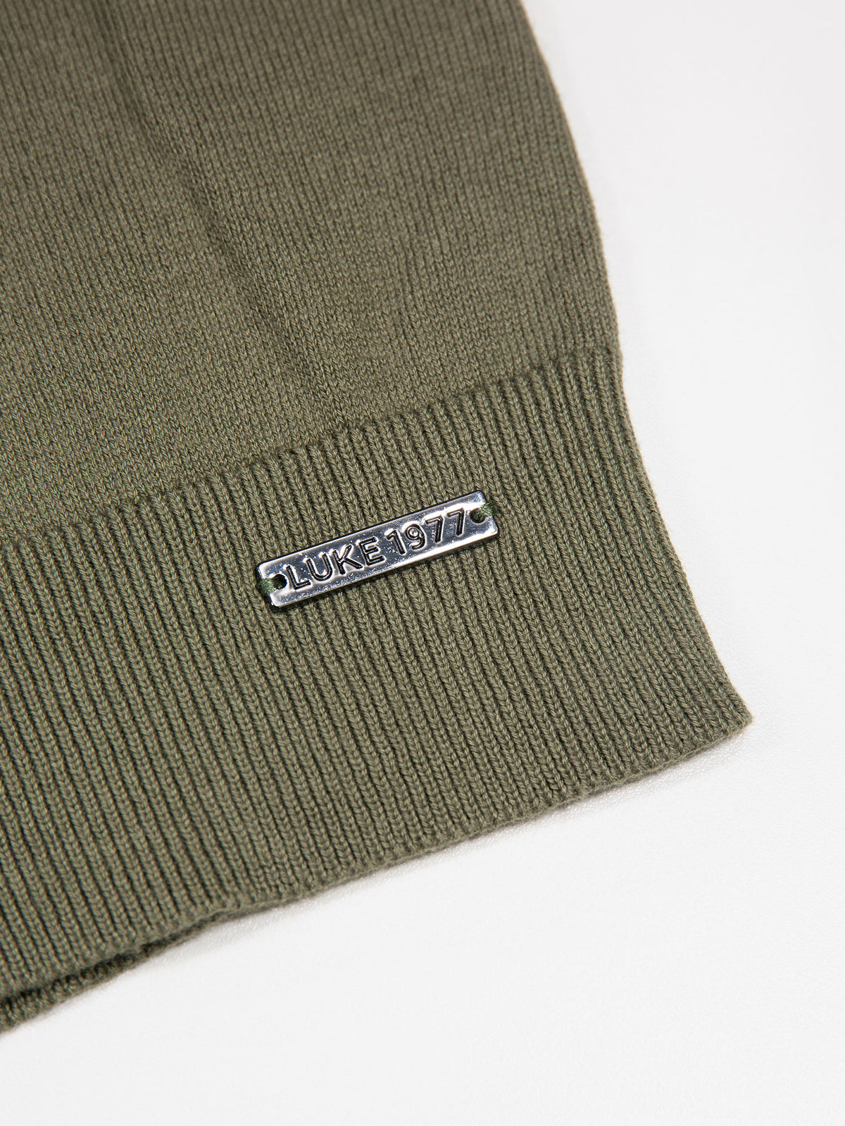 Men's green jumper.