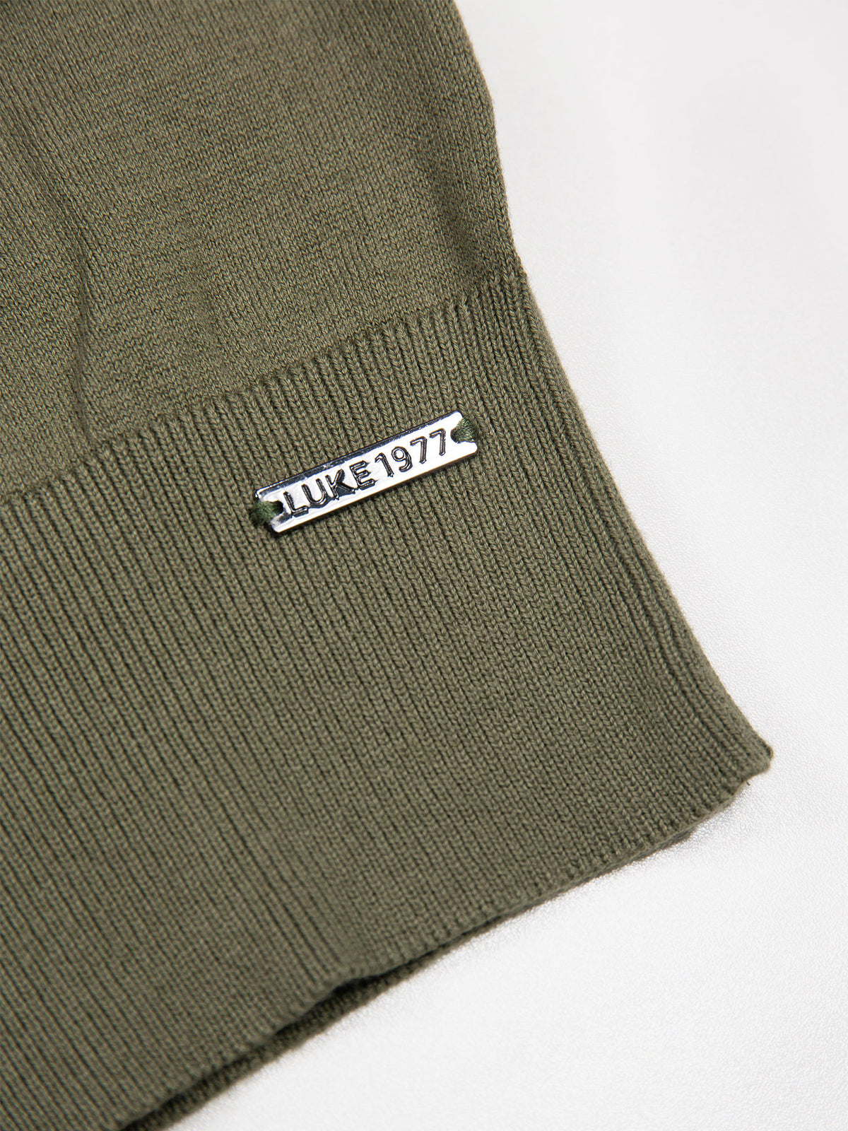 Men's green jumper.