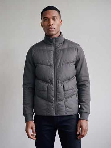 Man wearing charcoal LUKE 1977 Tinto funnel neck padded jacket, front view