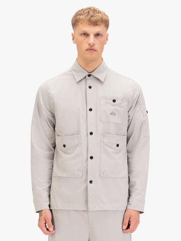 Men's grey shirt with button-up front.