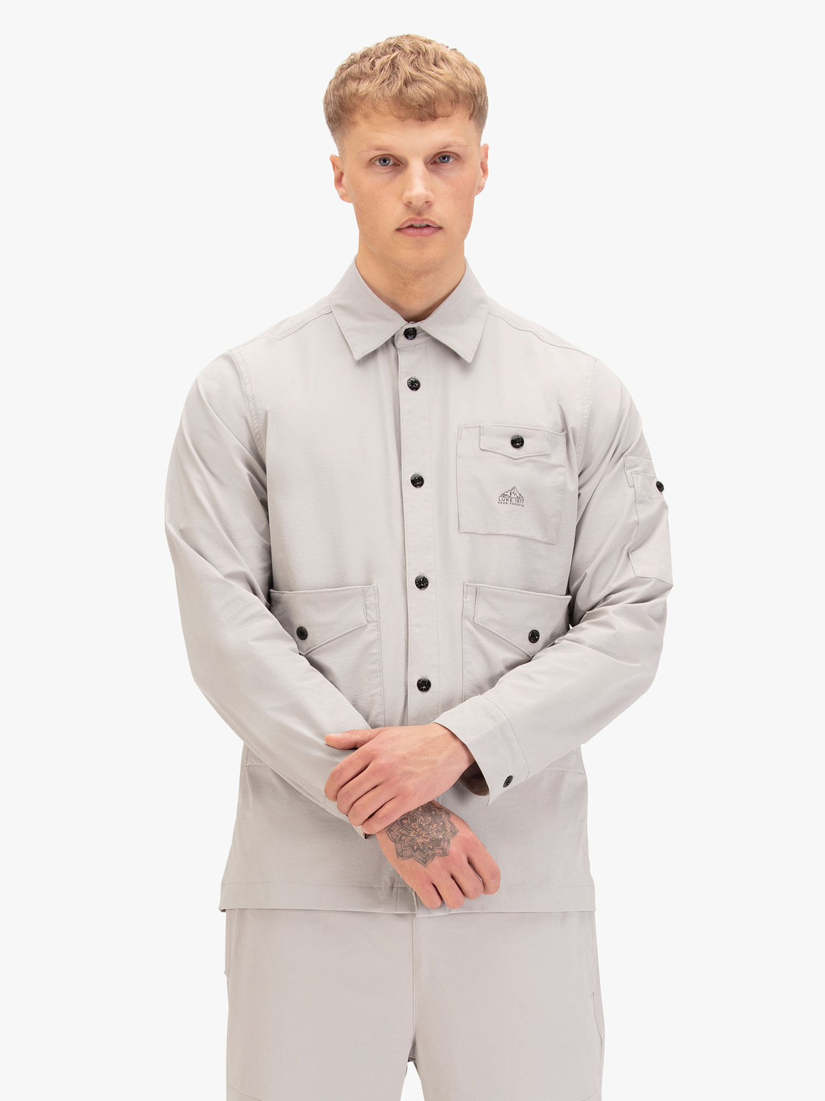 Men's grey shirt with button-up front.