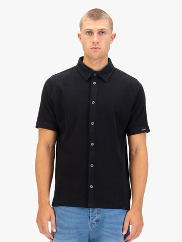 Men's black polo shirt with polo collar.