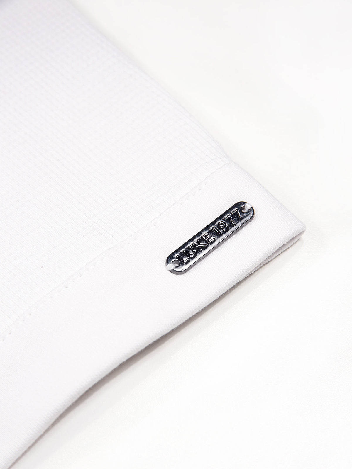 Men's white polo shirt with polo collar.