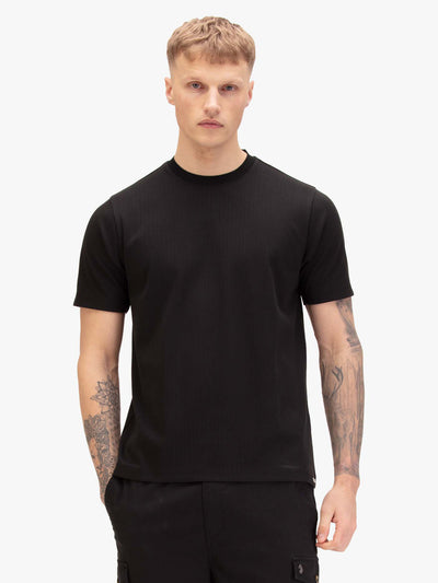 Men's black t-shirt with crew neck and short sleeves, worn by a model, front view