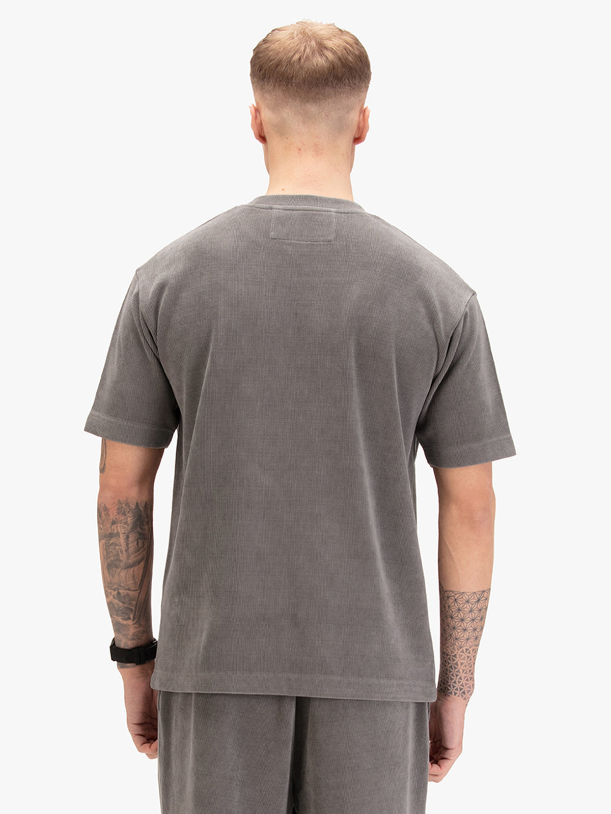 Men's relaxed-fit grey t-shirt with crew neck and short sleeves, worn by a model, back view