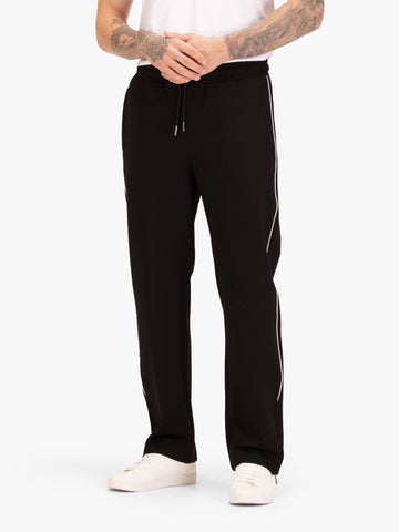 Men's straight-leg black joggers with drawstring waistband, worn by a model, front view