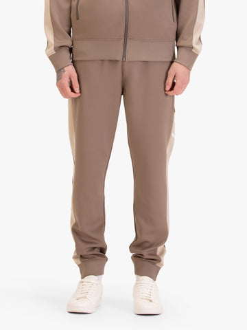 Men's brown joggers, worn by a model, front view