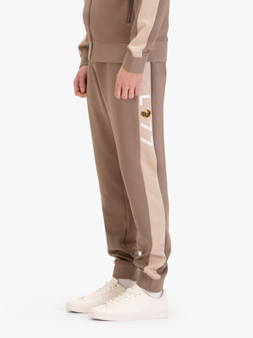 Men's brown joggers, worn by a model, worn by a model, side view
