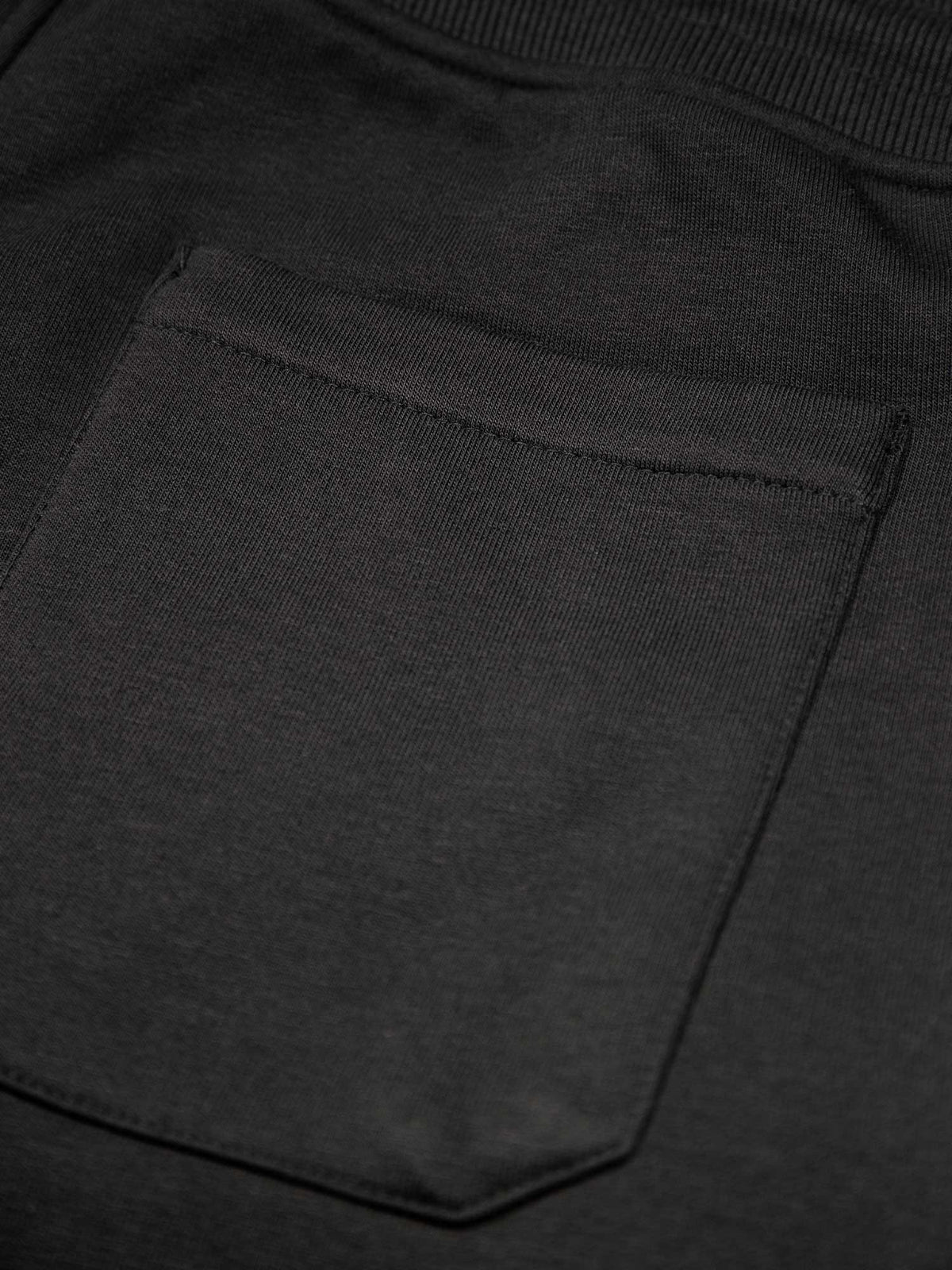 Men's wide-leg black joggers with drawstring waistband, detail view 3