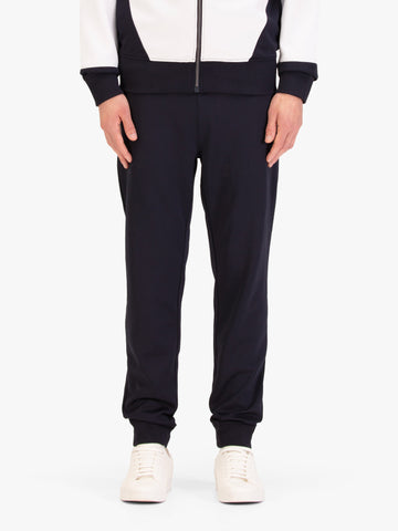Men's navy joggers, worn by a model, front view