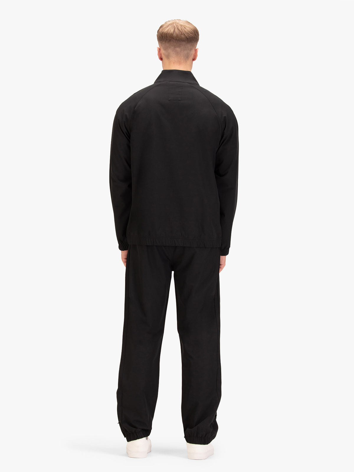 Back view of black LUKE 1977 Moseley lightweight tracksuit worn by model