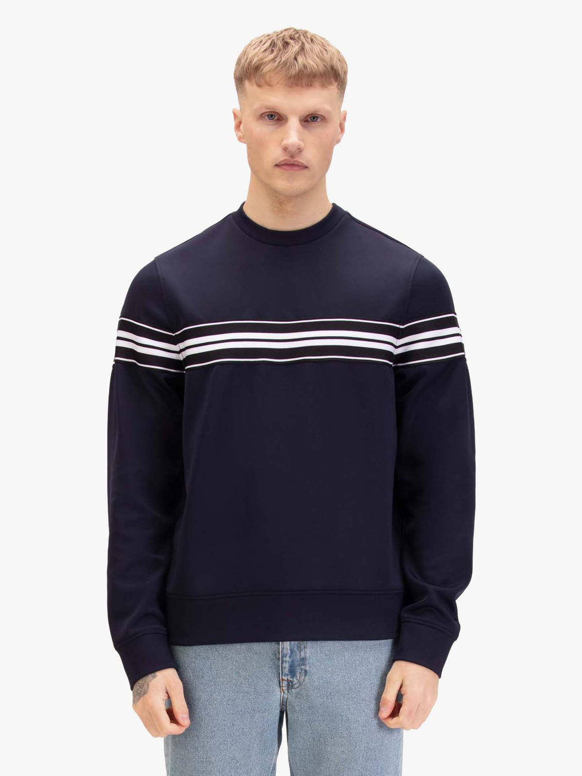 Men's navy sweatshirt with crew neck, worn by a model, front view
