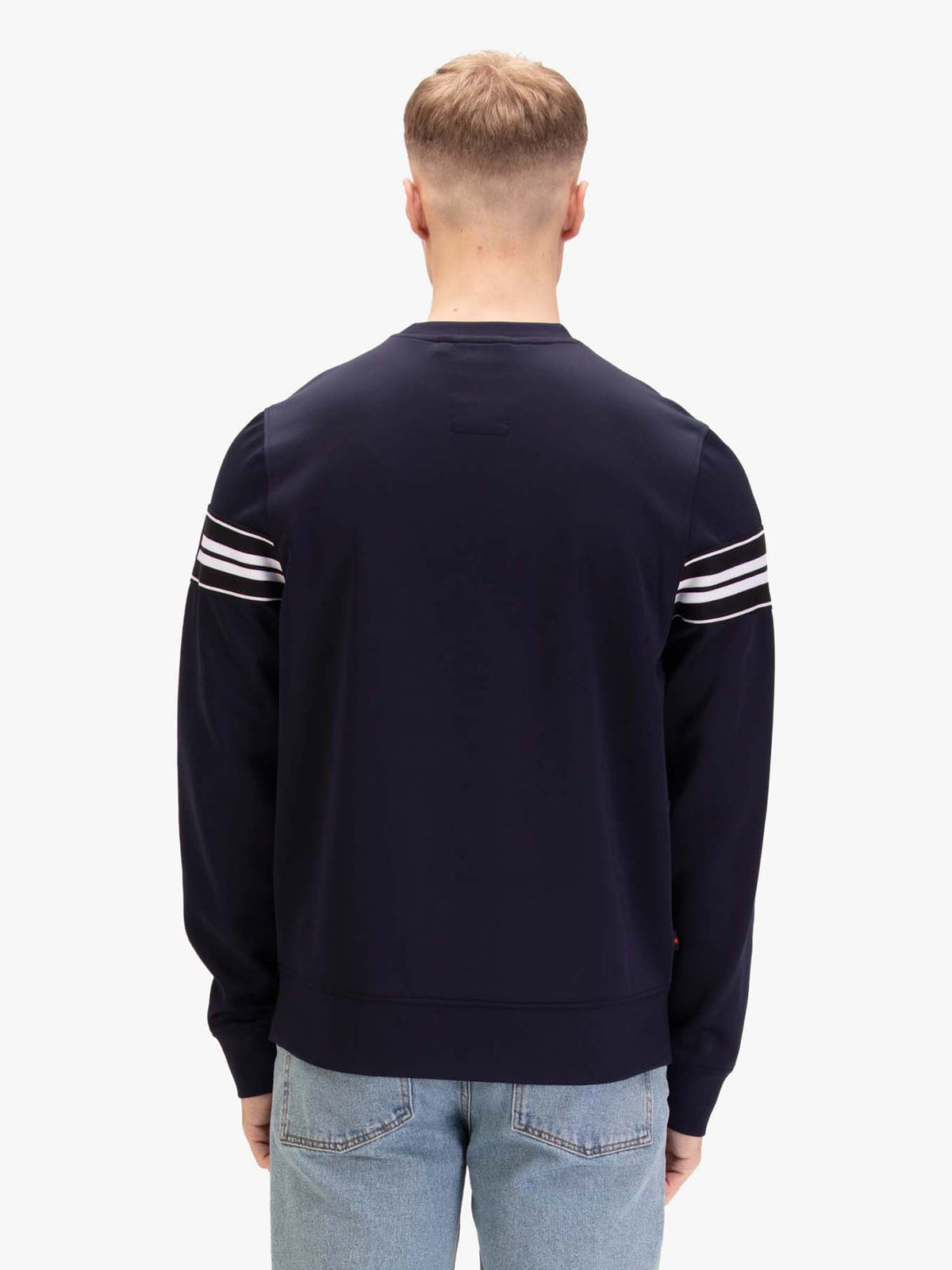Men's navy sweatshirt with crew neck, worn by a model, back view