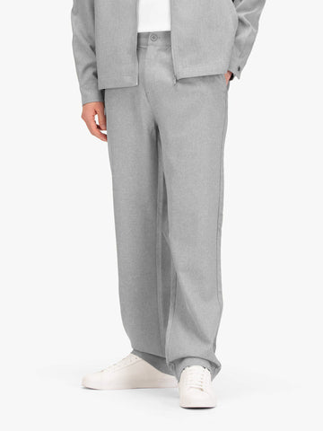 Men's straight-leg grey trousers with elasticated waistband, worn by a model, front view