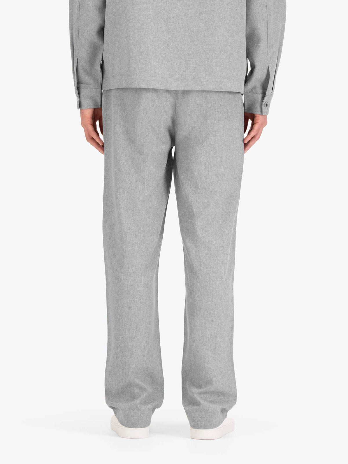 Men's straight-leg grey trousers with elasticated waistband, worn by a model, back view