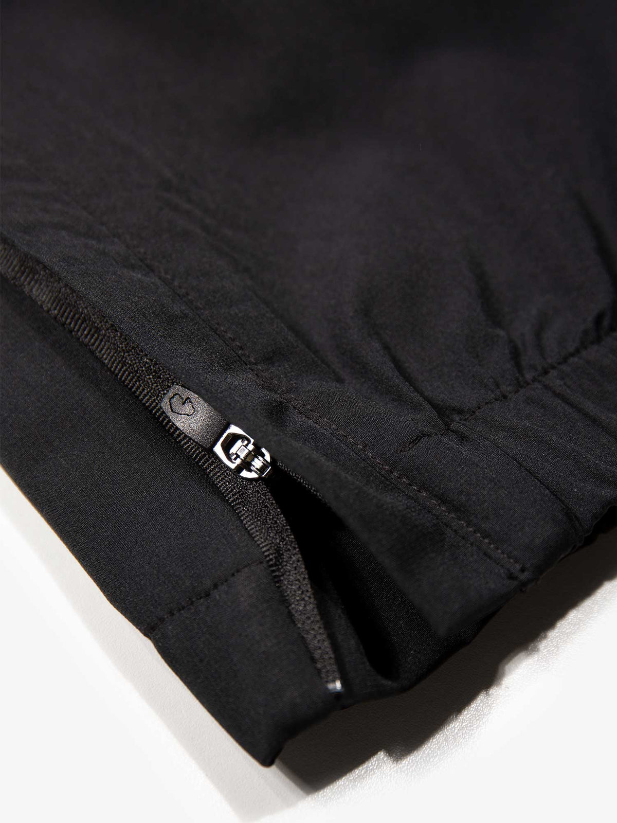 Close-up of ankle zip on black LUKE 1977 Knowle lightweight joggers from the Moseley tracksuit