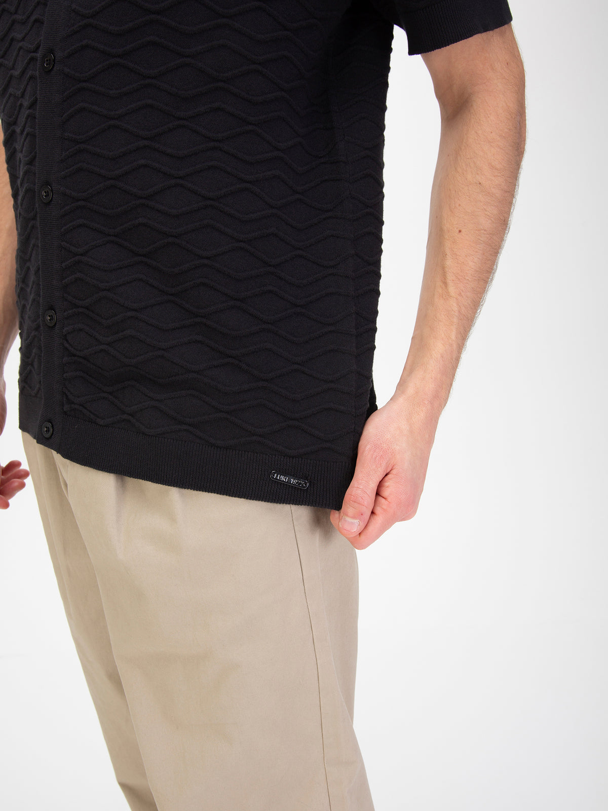 Men's black jumper, worn by a model