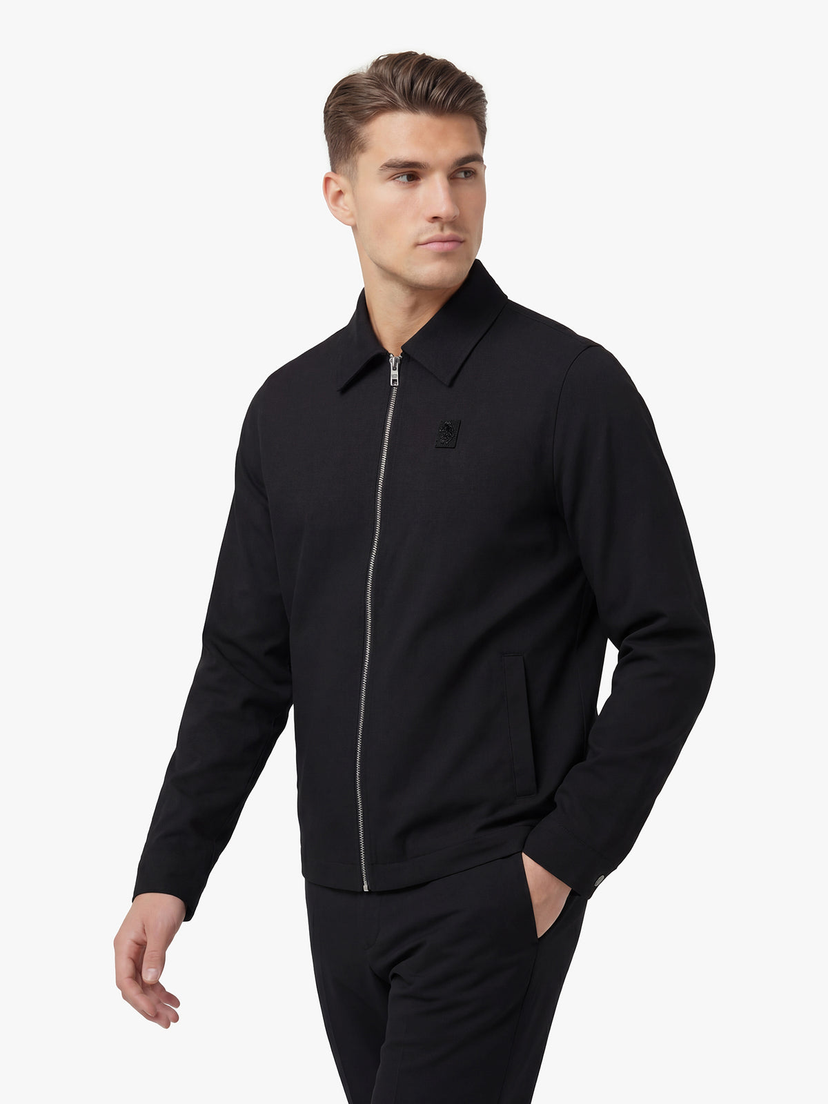 Men's black jacket with snap-button front and front pocket, back view