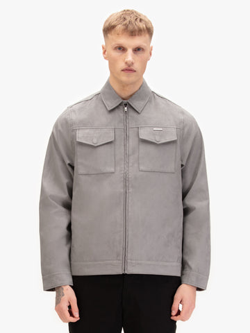 Men's grey jacket with zip-up front and front pocket, worn by a model, side view