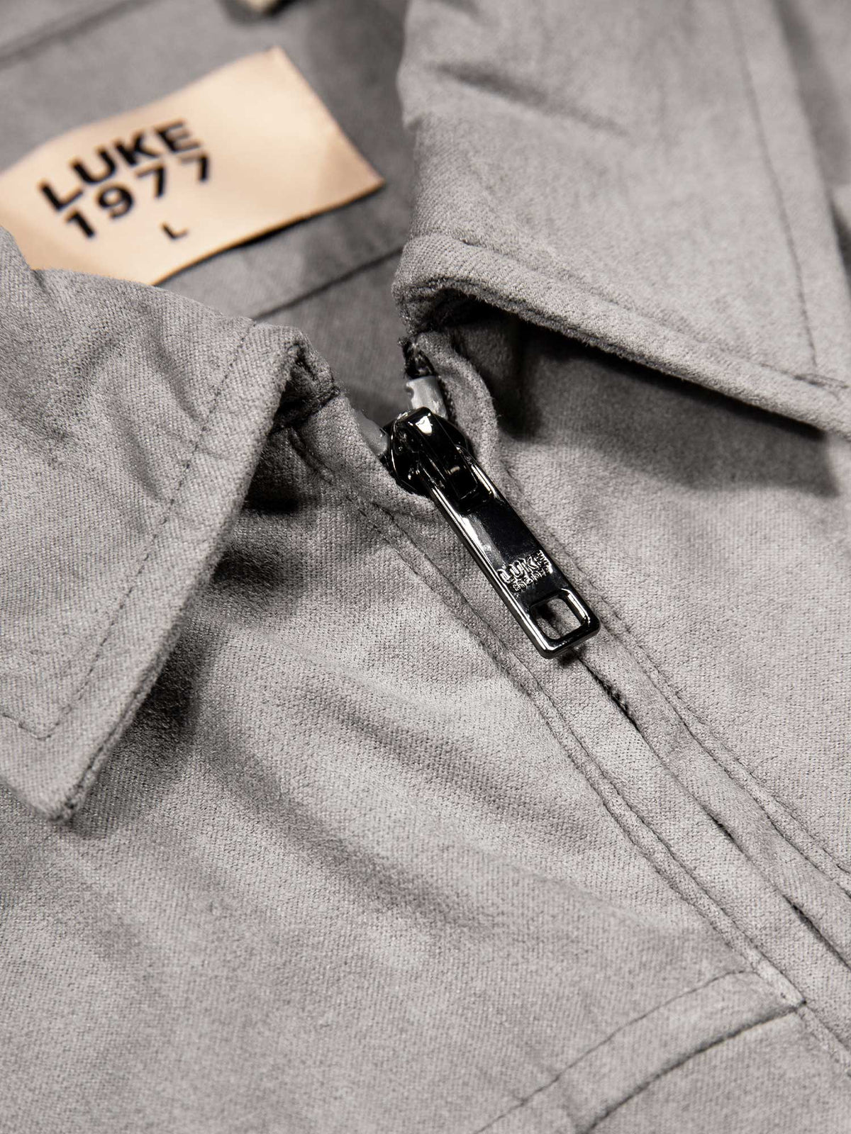 Men's grey jacket with zip-up front and front pocket, detail view 1