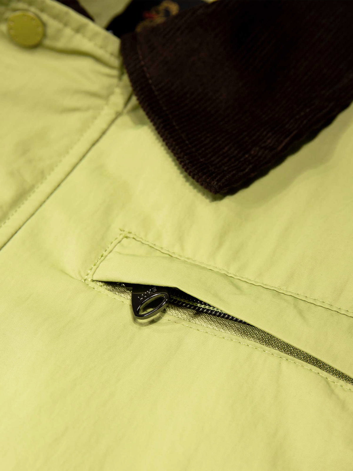 Men's green jacket with zip-up front and chest pocket.