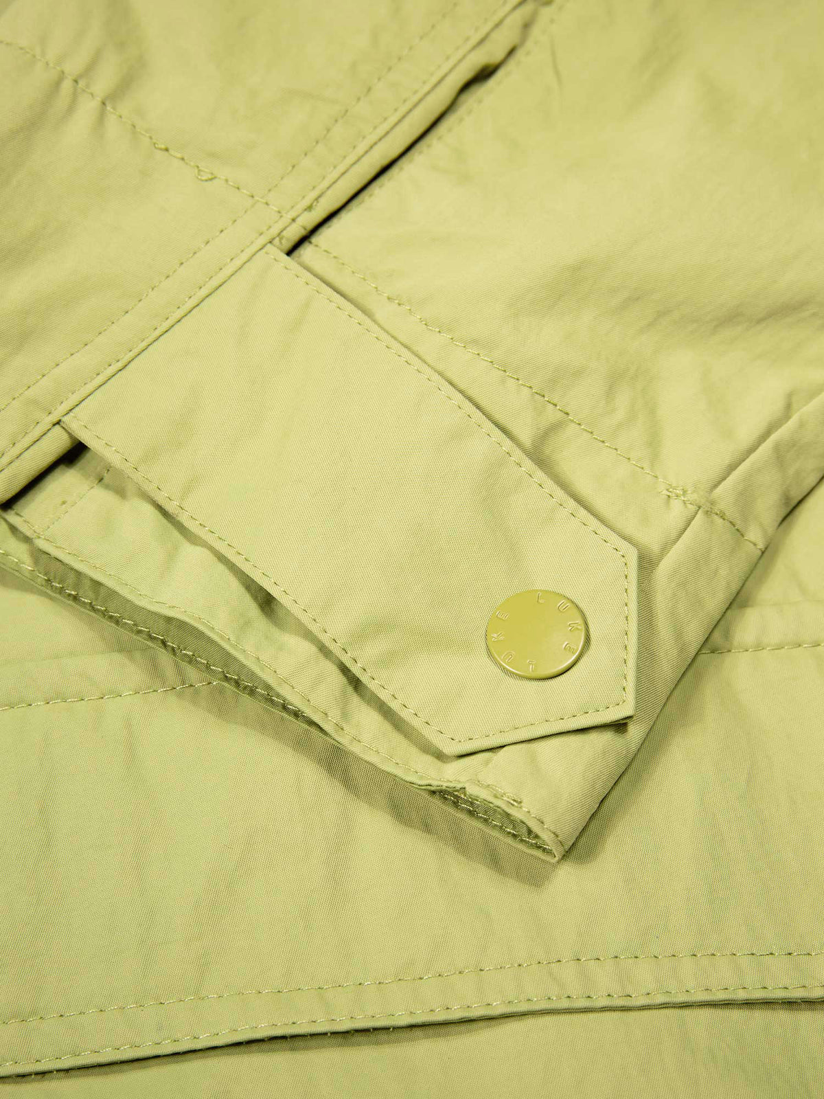 Men's green jacket with zip-up front and chest pocket.