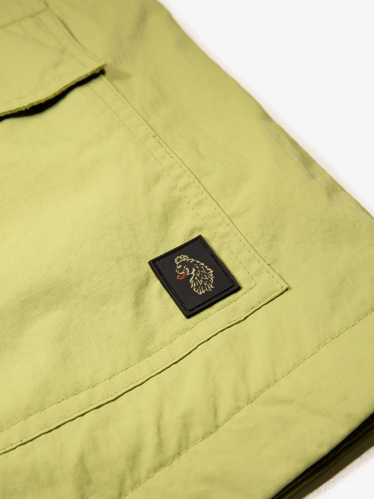 Men's green jacket with zip-up front and chest pocket.