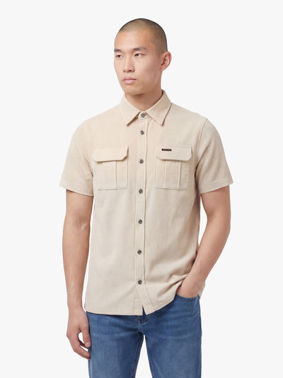 Men's beige shirt with button-up front, back view