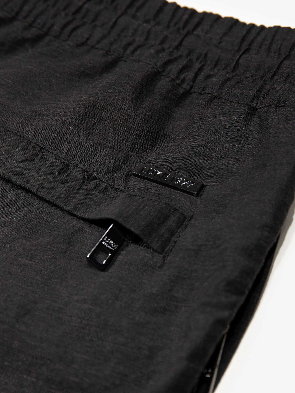 Men's black shorts with drawstring waistband and cargo pockets.