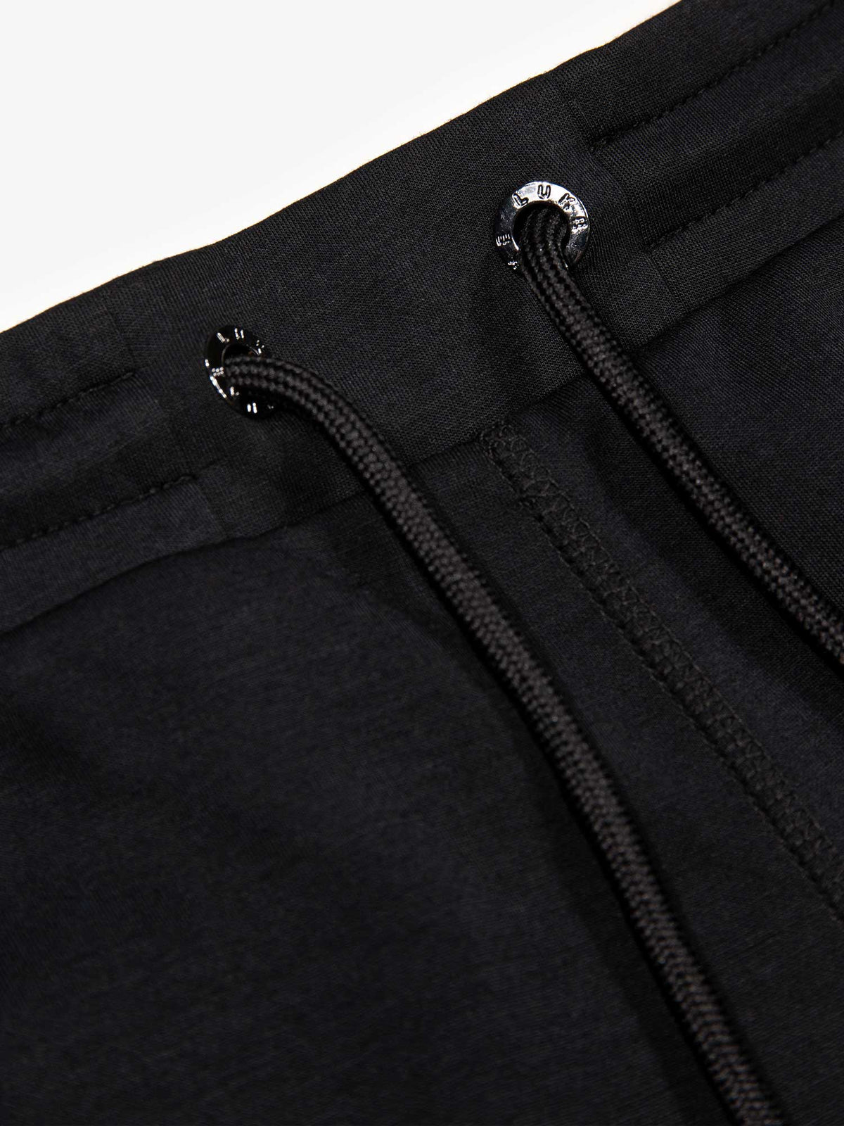 Men's black shorts with drawstring waistband, detail view 1