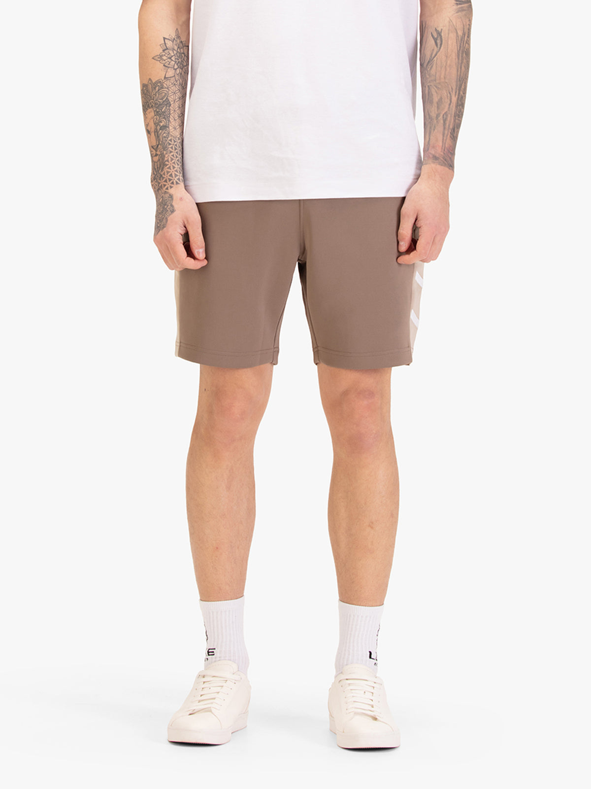 Men's brown shorts with drawstring waistband, worn by a model, front view