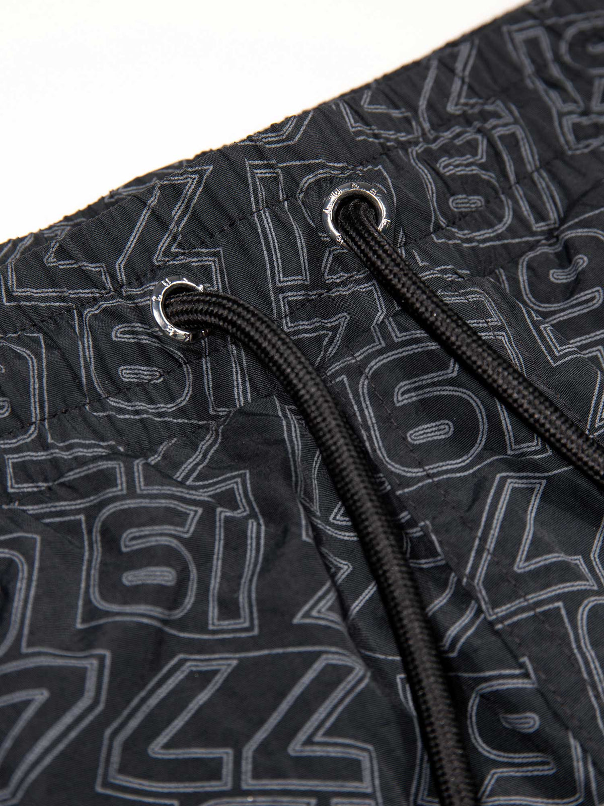 Men's black swim shorts with drawstring waistband, detail view 1