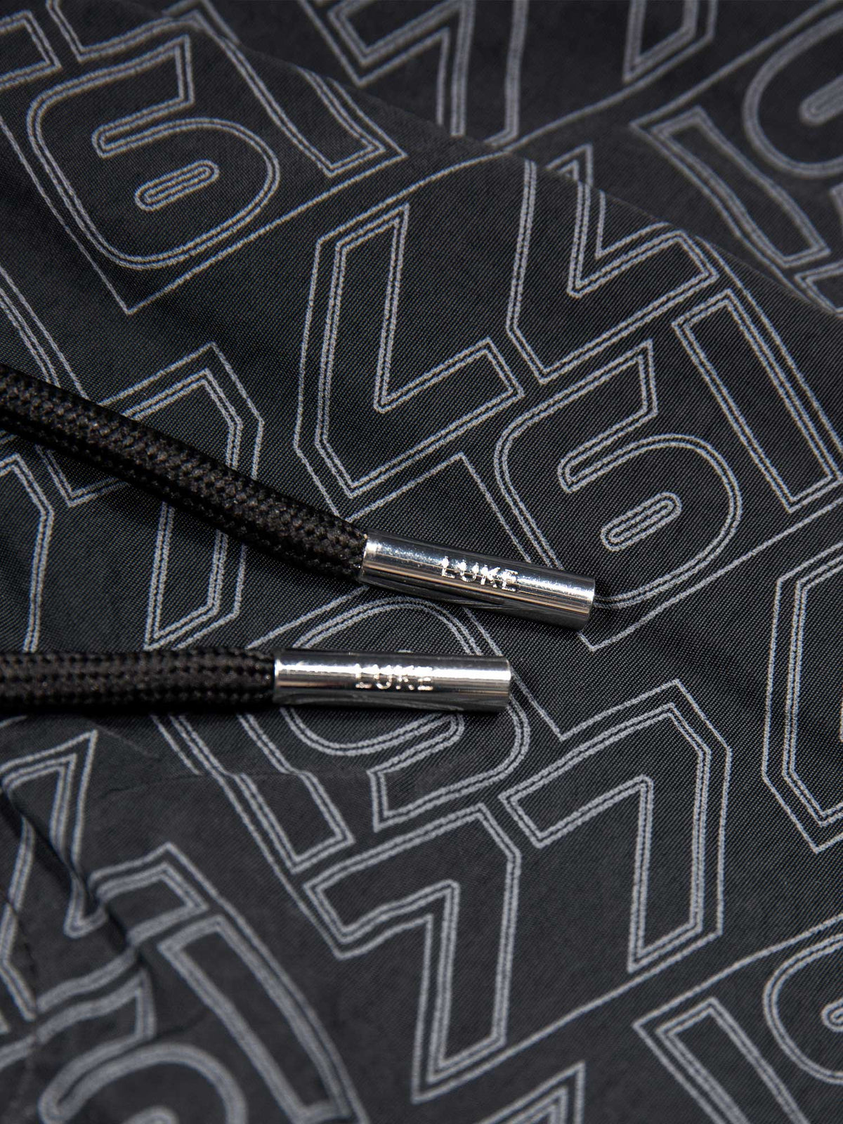 Men's black swim shorts with drawstring waistband, detail view 2