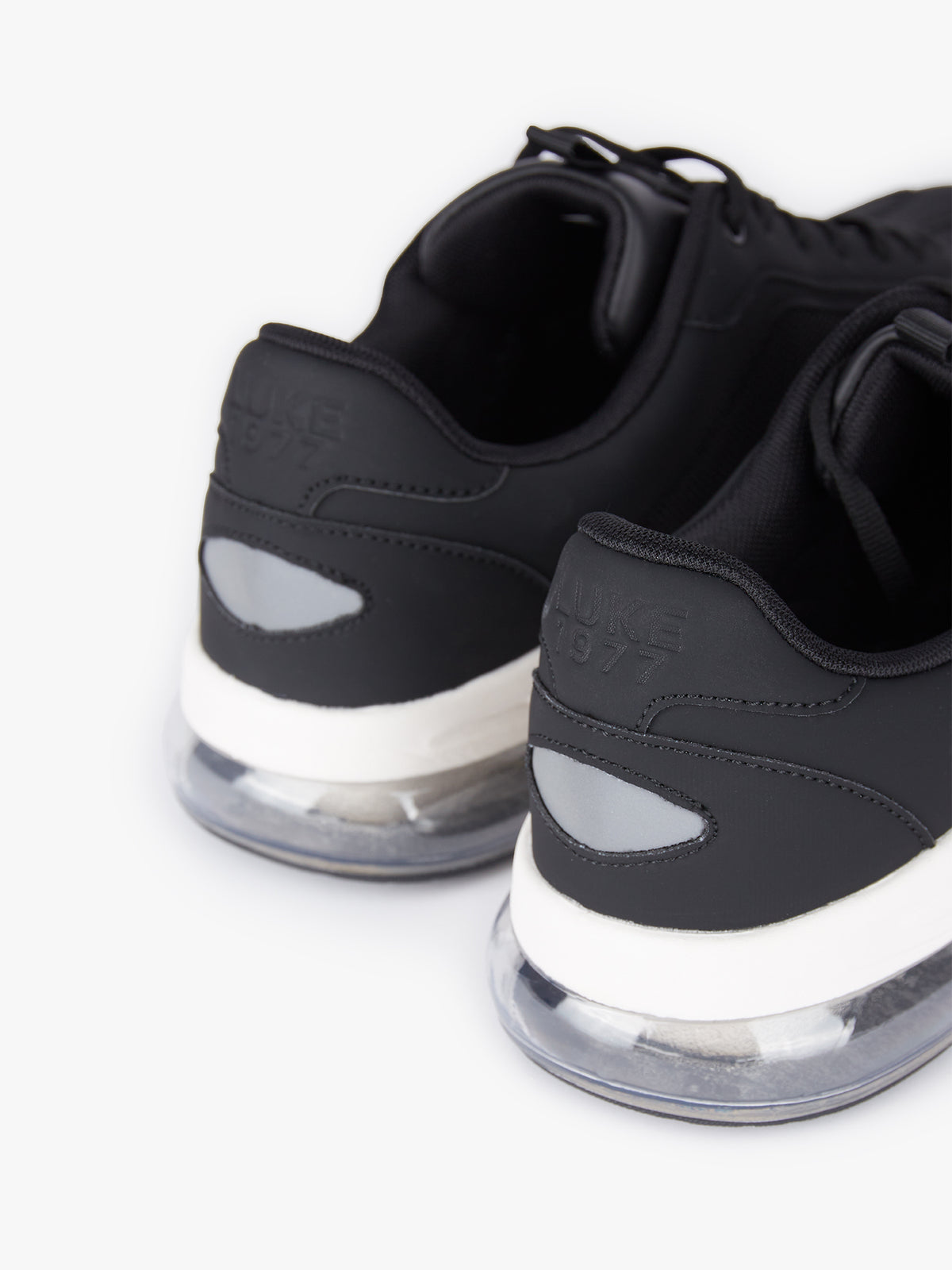 Men's black footwear.